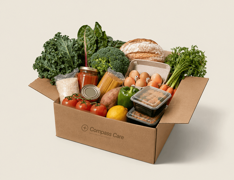 Cardboard box filled with fresh groceries